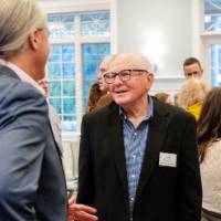 Two guests mingle before the dinner